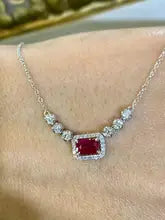 Ruby and lab grown diamond halo necklace in 14k white gold